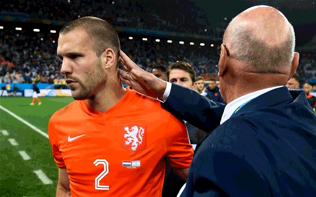 Holland v Argentina, World Cup semi-final: Dutchman Ron Vlaar is consoled after missing his penalty in the shootout. Photo: Getty Images